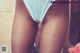 A close up of a woman's butt in a blue panties.